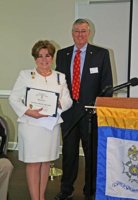 Vice President Rick Reese presents guest speaker Paula Nelson with a Certificate of Speaker Appreciation.